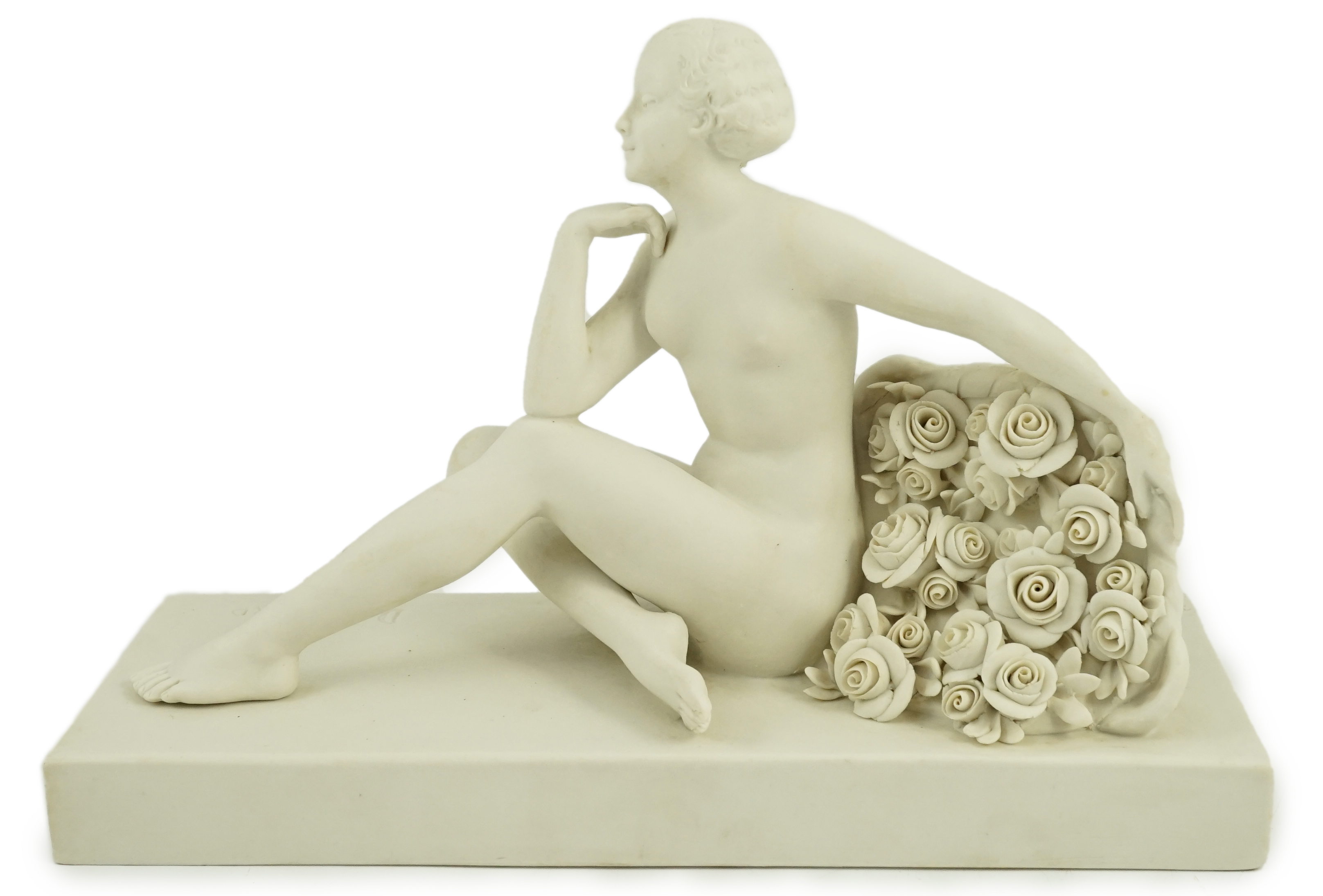 Henri Désiré Grisard (1872 - active until 1940). A signed bisque model of a seated nude by flowers, 1920s